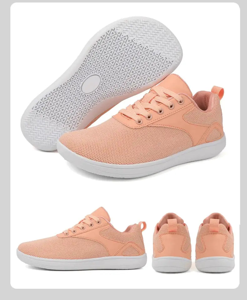 Pair of peach mesh wide-toed sneakers with white sole for casual walking and jogging