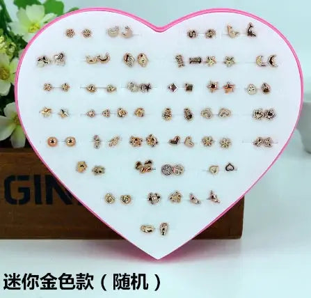 New Design 36-pair resin stud earrings by Simples Market on a pink heart display; snowflake, cat, butterfly shapes