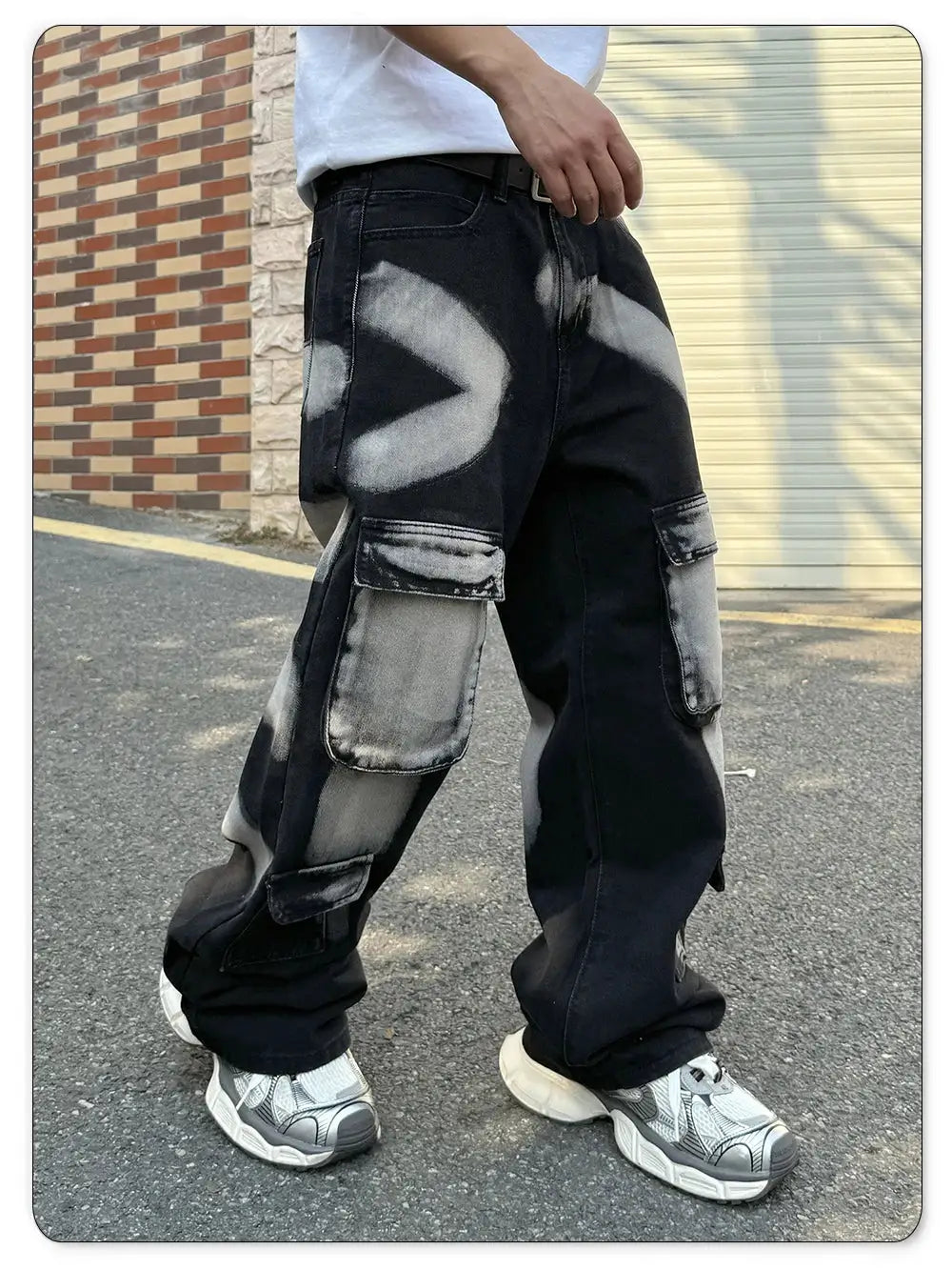 Simples Market men's black straight-leg workwear jeans with multiple cargo pockets and splashed ink pattern.