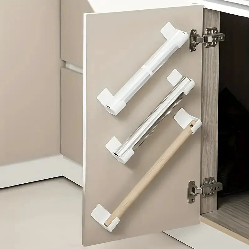 4-pack punch-free kitchen cabinet storage racks mounted on a door; white plastic organizers for plastic wrap and garbage bags.