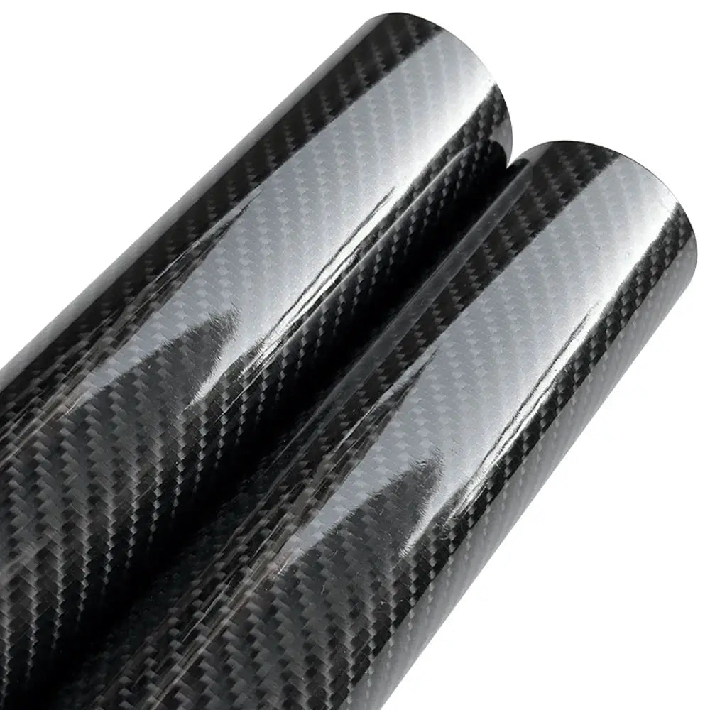 Two glossy 9D carbon fiber vinyl wrap rolls for cars; self-adhesive, anti-scratch auto decoration.