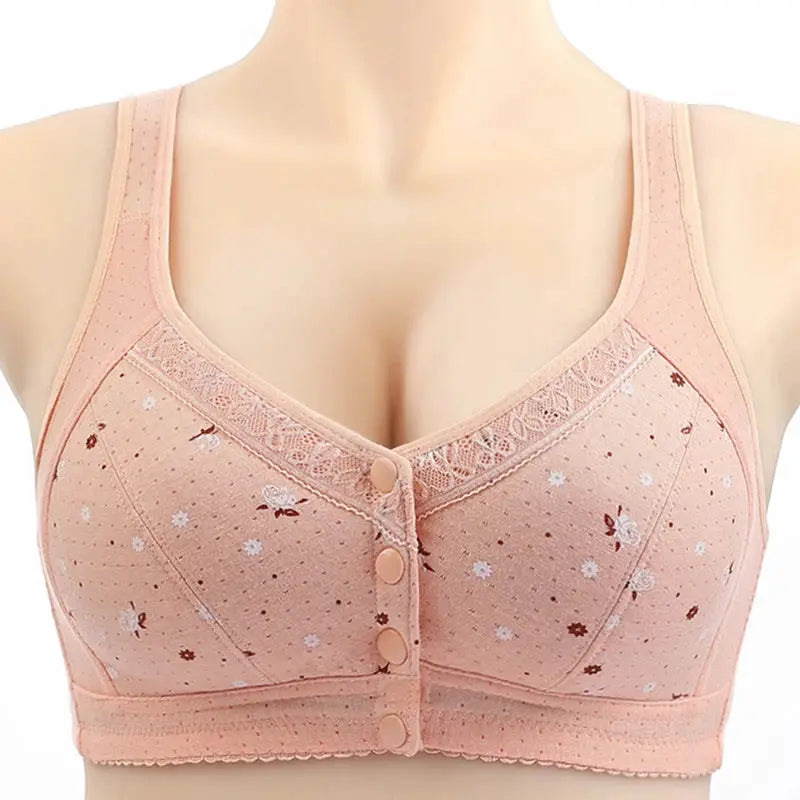 Front-closure lace bra in peach with floral print and lace trim.