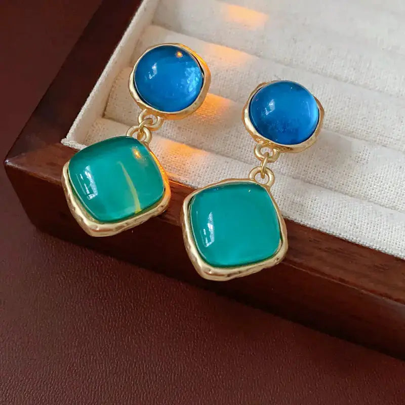 Simples Market vintage resin earrings; blue round tops, teal square drops with gold-tone settings