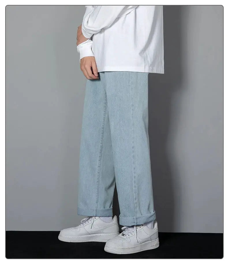 Korean men's casual wide-leg denim jeans in light blue with rolled cuffs.
