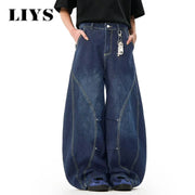 Men's blue denim wide-leg jeans with a baggy balloon silhouette, contrast stitching, and a keychain attached.