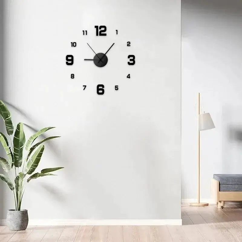 Large black wall clock with bold numerals on a white wall for modern living room decor.
