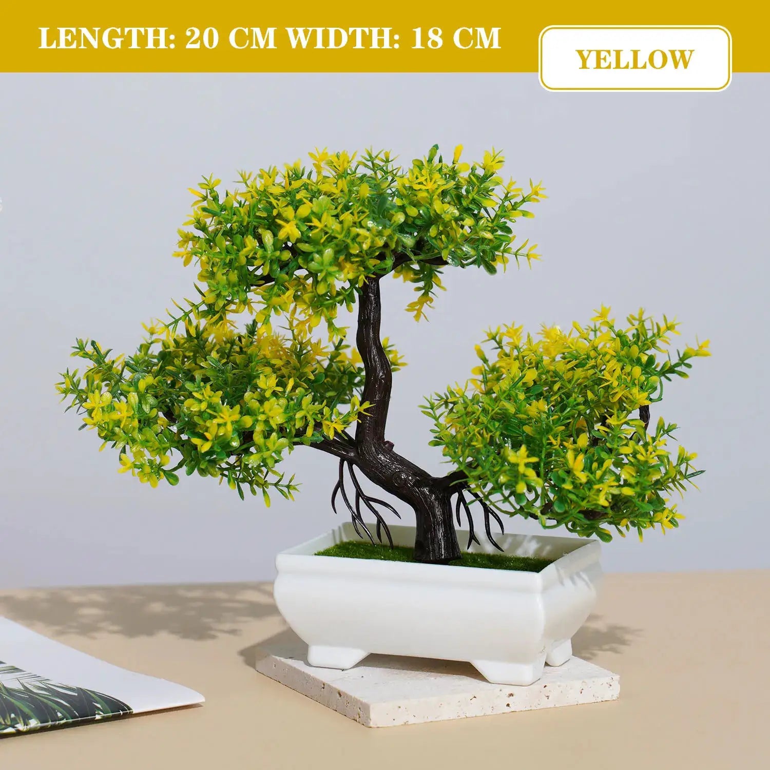 Artificial bonsai small tree with yellow-green leaves in a white ceramic rectangular pot for tabletop decor.