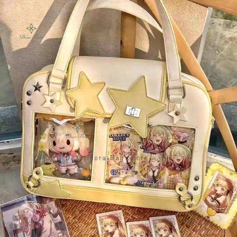 Beige Y2K star Ita bag with two transparent front pockets and yellow star patches.