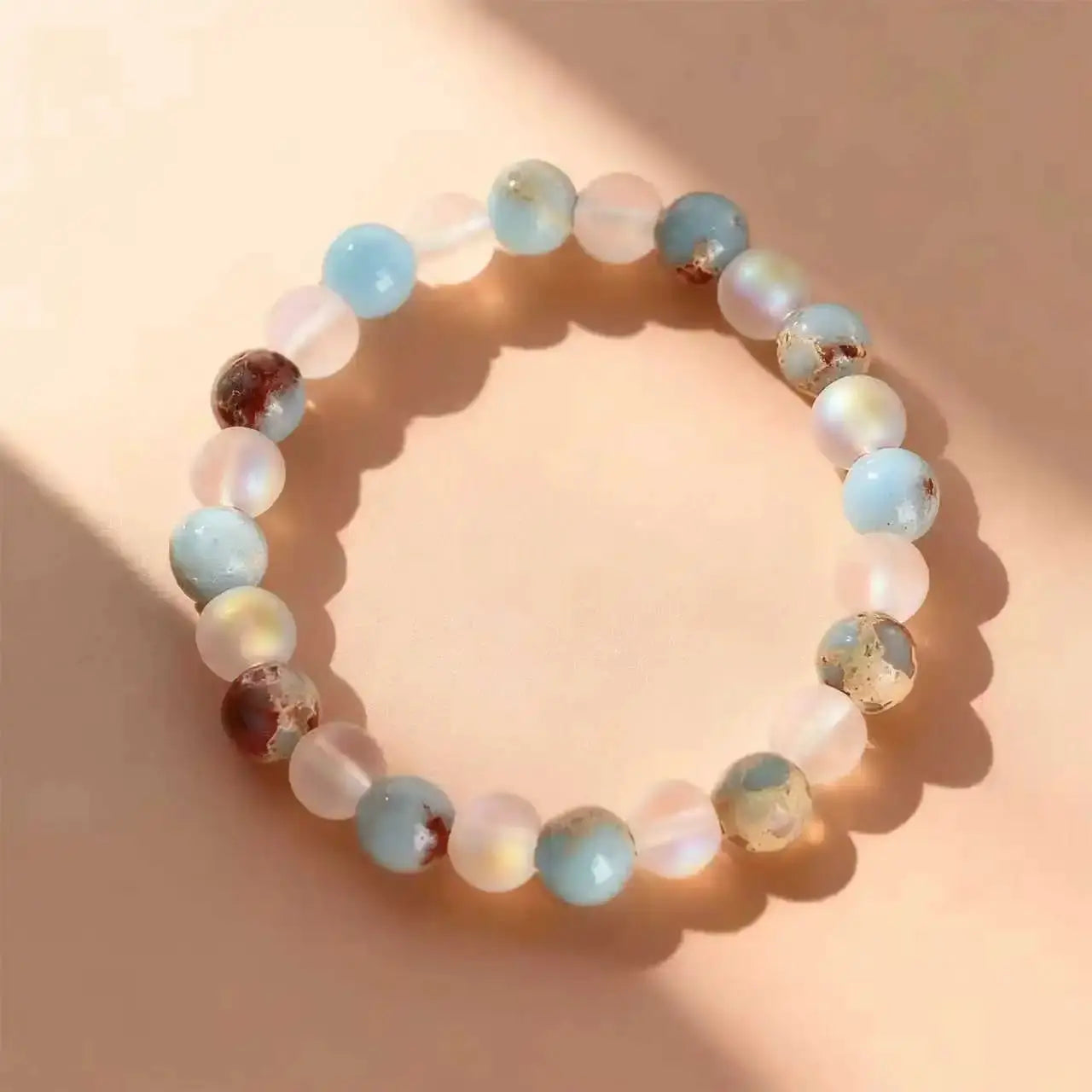 Halo Quartz Ocean Sediment Beaded Bracelet - pastel blue, pink and translucent beads, unisex