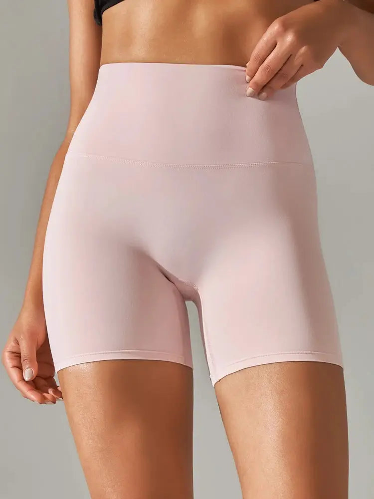 Women pink high-waist sport yoga shorts for workouts with stretch fabric