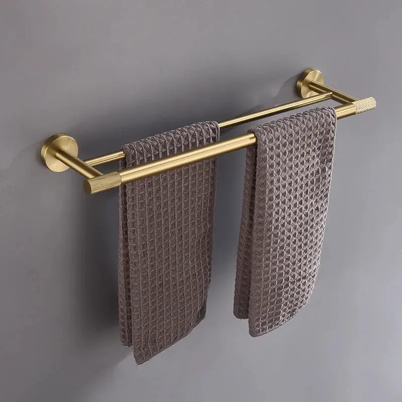 Brushed gold brass bathroom hardware set with dual towel bars and knurled ends, wall-mounted