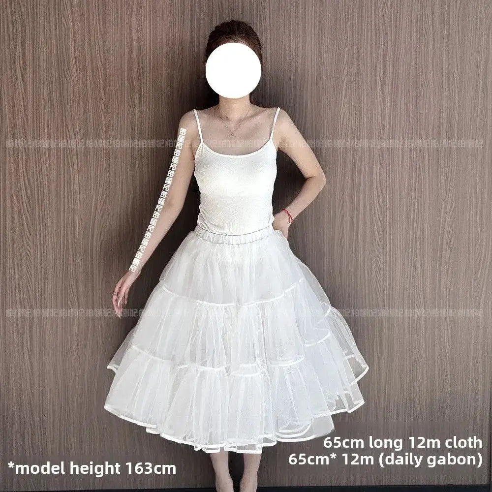 White tiered tulle Lolita petticoat worn by model; fluffy underskirt