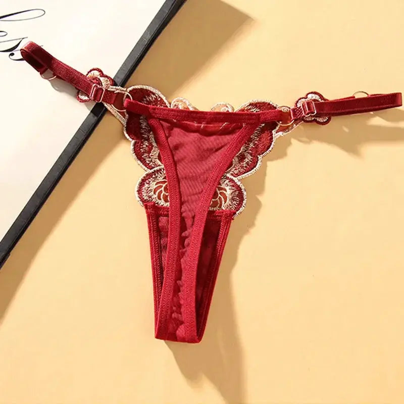 Butterfly lace thong for women, red low-rise G-string with sheer mesh and embroidered lace trim, adjustable waist.
