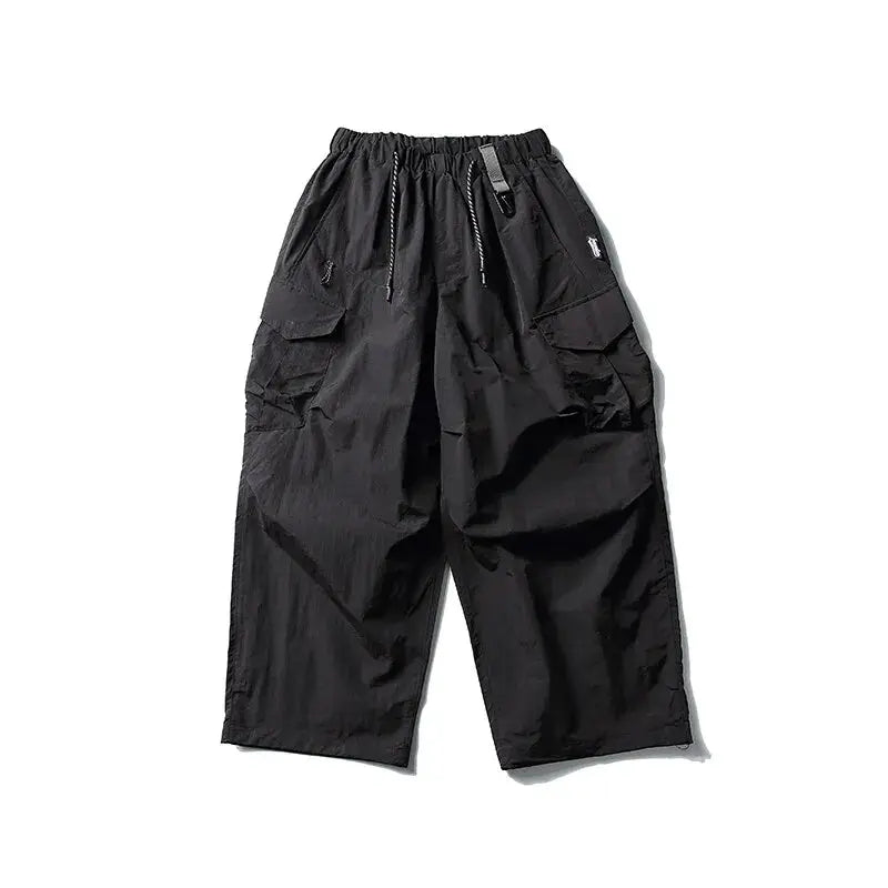 Ultra loose black cargo pants with wide leg and drawstring waist