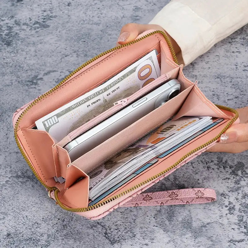 Simples Market pink faux-leather wallet clutch with gold zipper, large capacity, holding cash and phone.