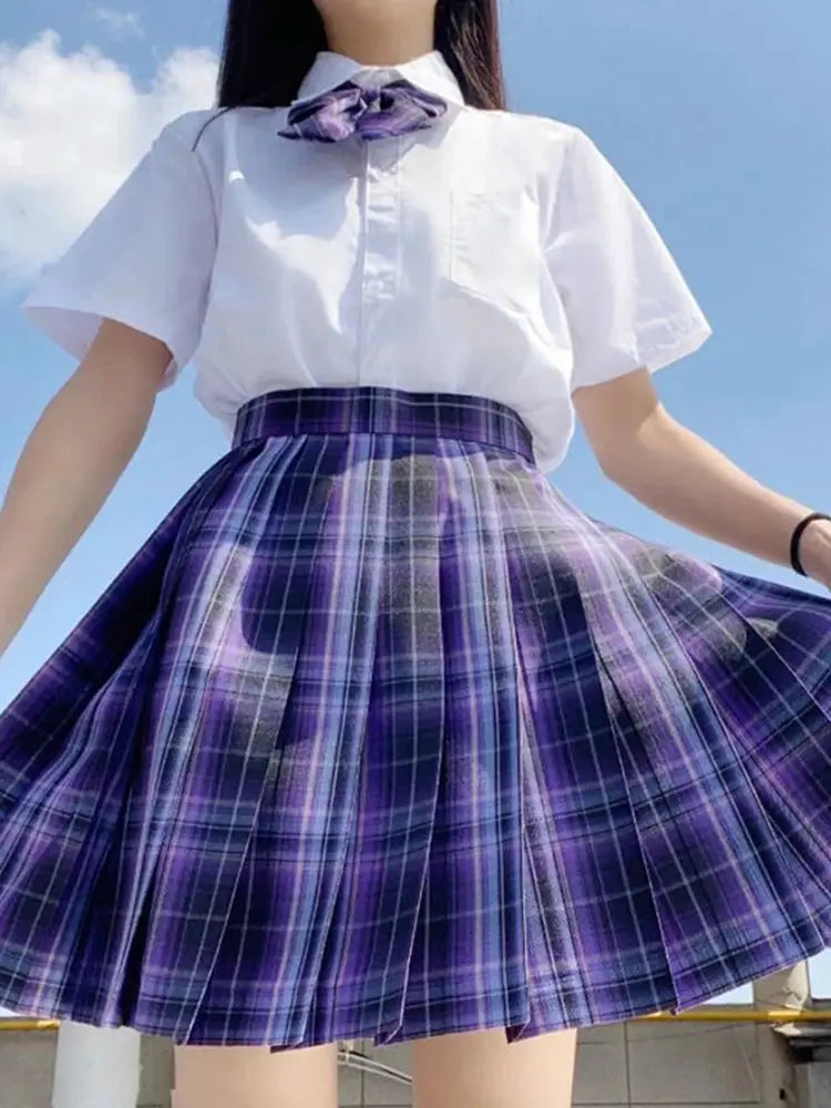 ZOKI plaid pleated mini skirt with white blouse and purple bow; 2-piece set by Simples Market