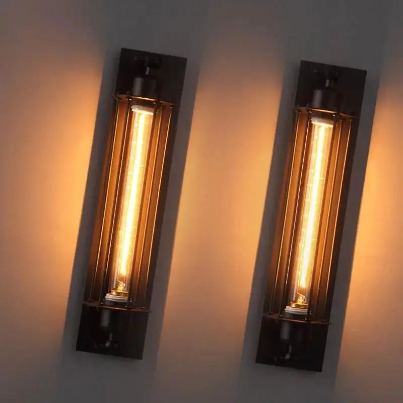 Retro industrial iron wall light pair in dark metal with warm LED tubes