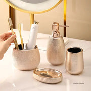 Rose gold ceramic bathroom accessories set with toothbrush holder, lotion pump, soap dish, and cup (5 pieces)