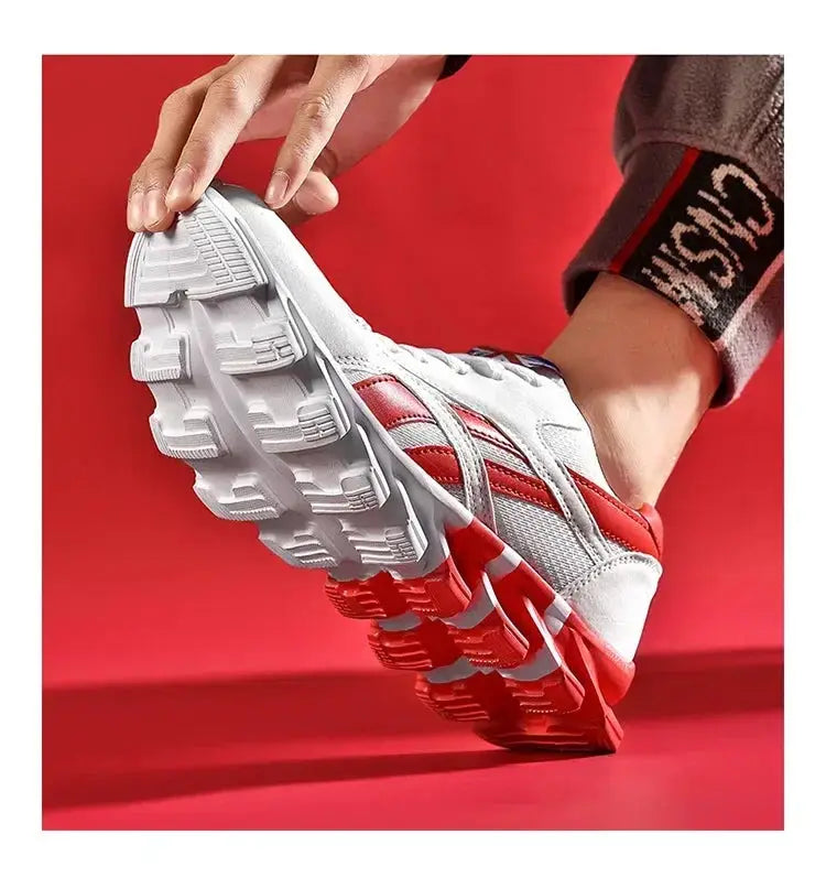 Men's fitness sneakers in white with red accents; thick rugged outsole with wear-resistant cushioning