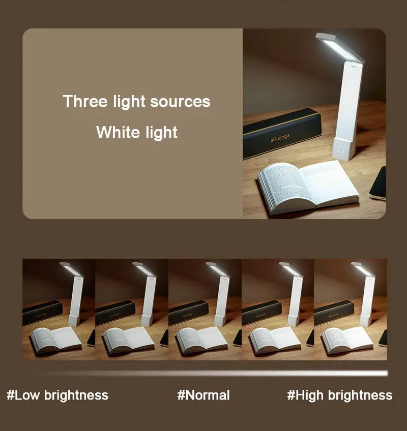 Simples Market LED desk lamp, foldable white finish with three light sources on a wooden desk beside an open book