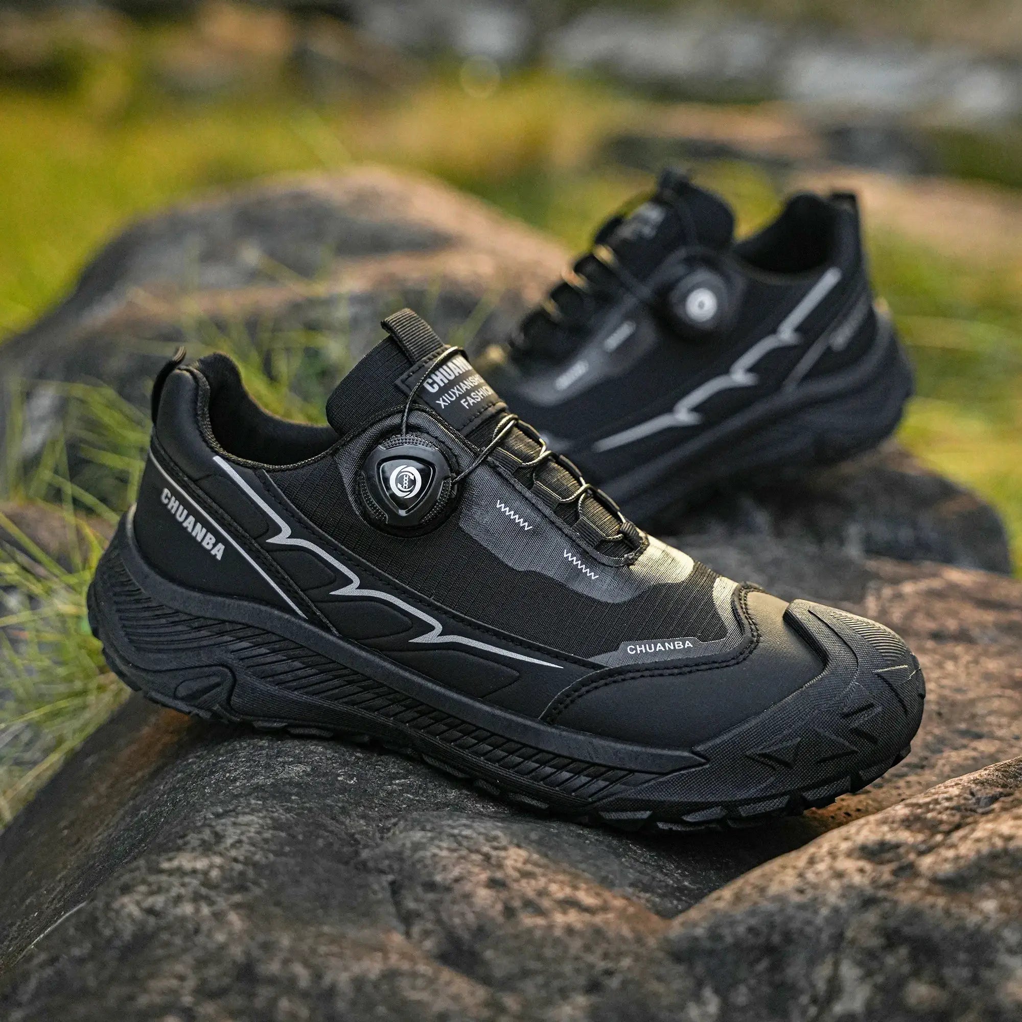 Two black CHUANBA low-top casual sneakers with strap and laces, lightweight walking shoes.