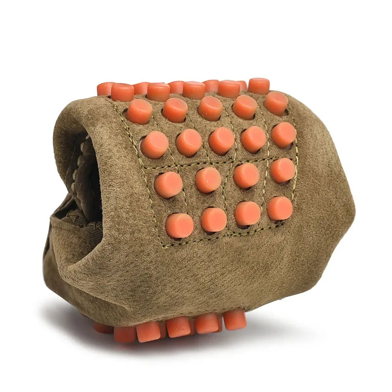 Men's suede driving shoe by Simples Market with orange studs on a tan-brown sole.