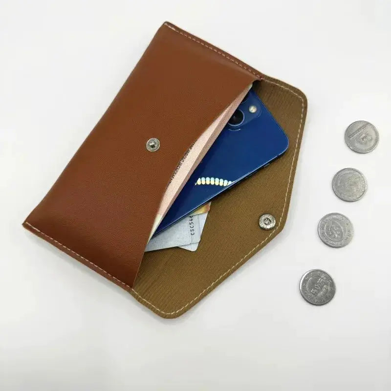 Unisex retro long leather wallet, brown exterior with tan interior, snap closure; five coins shown beside.
