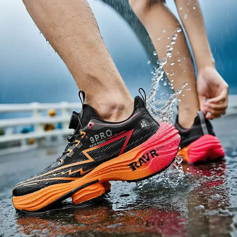 Simples Market pair of men's running shoes, black upper with orange cushioned sole and RAVR branding.