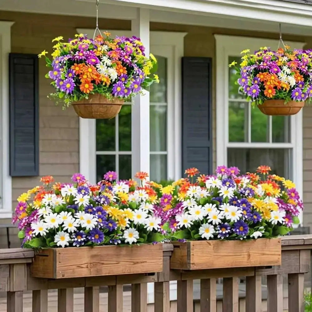 Artificial silk daisy flowers in two hanging baskets and two wooden planters; bright multicolor blooms.