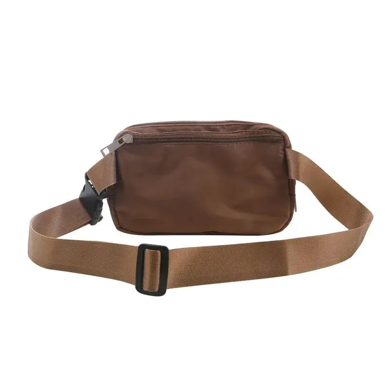 Brown nylon waist bag with zipper, tan adjustable strap, versatile fanny pack