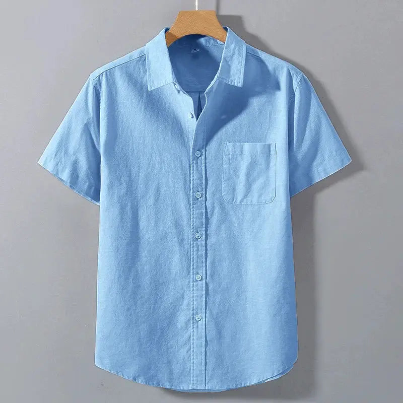 Men's light blue cotton short-sleeve shirt with chest pocket, breathable fabric.
