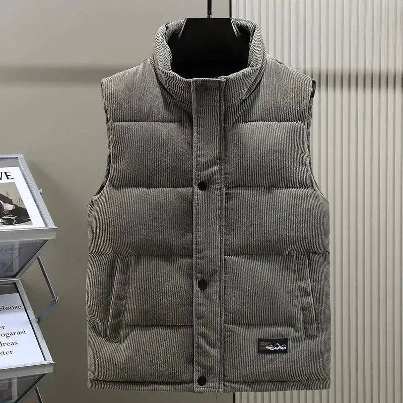 Men's gray padded corduroy sleeveless vest with stand collar and front button closure.