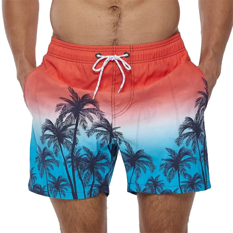 Men's beach swim shorts with orange-to-blue gradient palm tree print and white drawstring waist