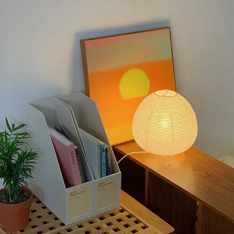 Japanese lantern LED table lamp with white rice-paper shade and warm ambient glow on a wooden desk