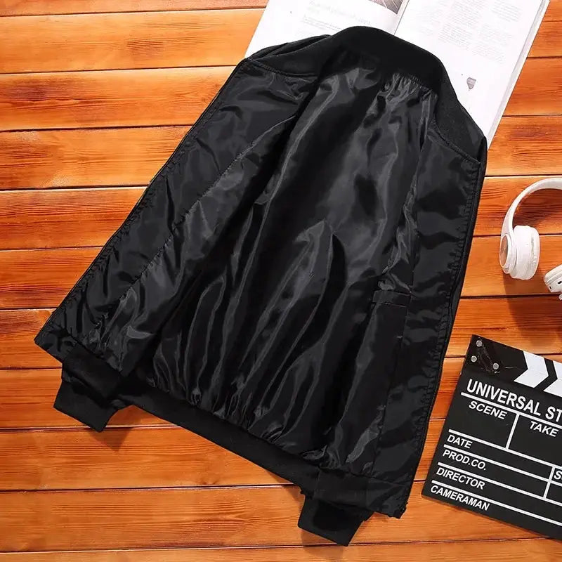 Men's lightweight windbreaker jacket, black with zip pockets, casual outdoor coat.