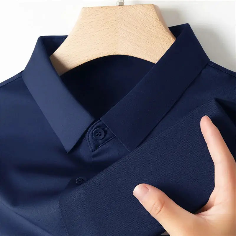 Men's navy polo shirt; short-sleeve, solid color, versatile business-casual top