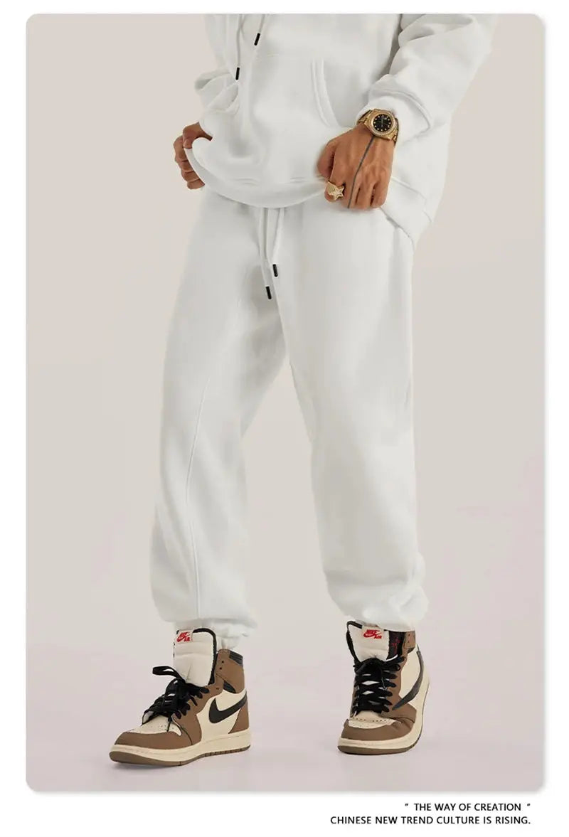 ZODF Trendy men 345gsm fleece sweatpants, white unisex joggers; Nike sneakers visible.