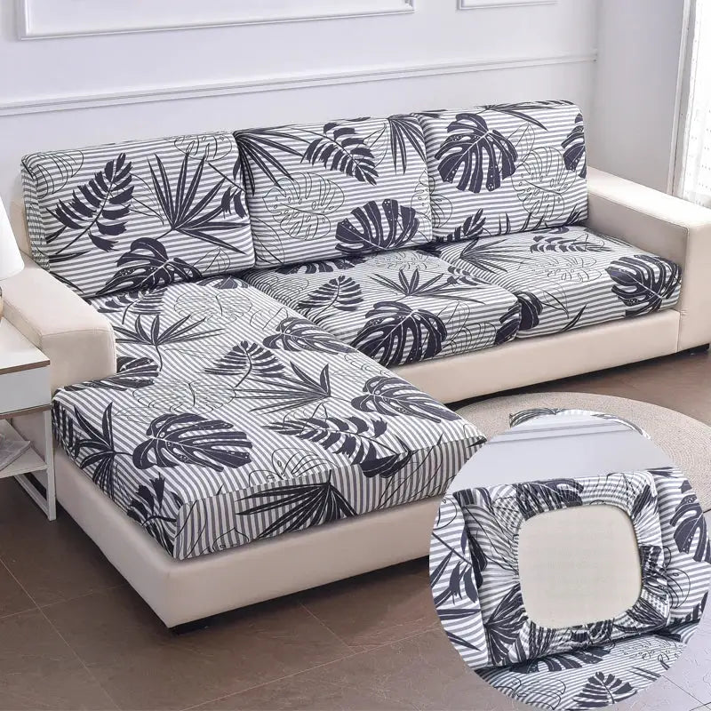 Stretch couch cushion slipcovers in gray and navy tropical leaf print; anti-slip protector Simples Market.