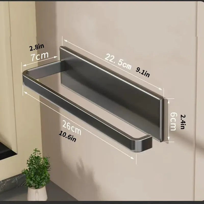 Wall-mounted kitchen paper towel holder by Simples Market, magnetic stainless steel on cabinet side.