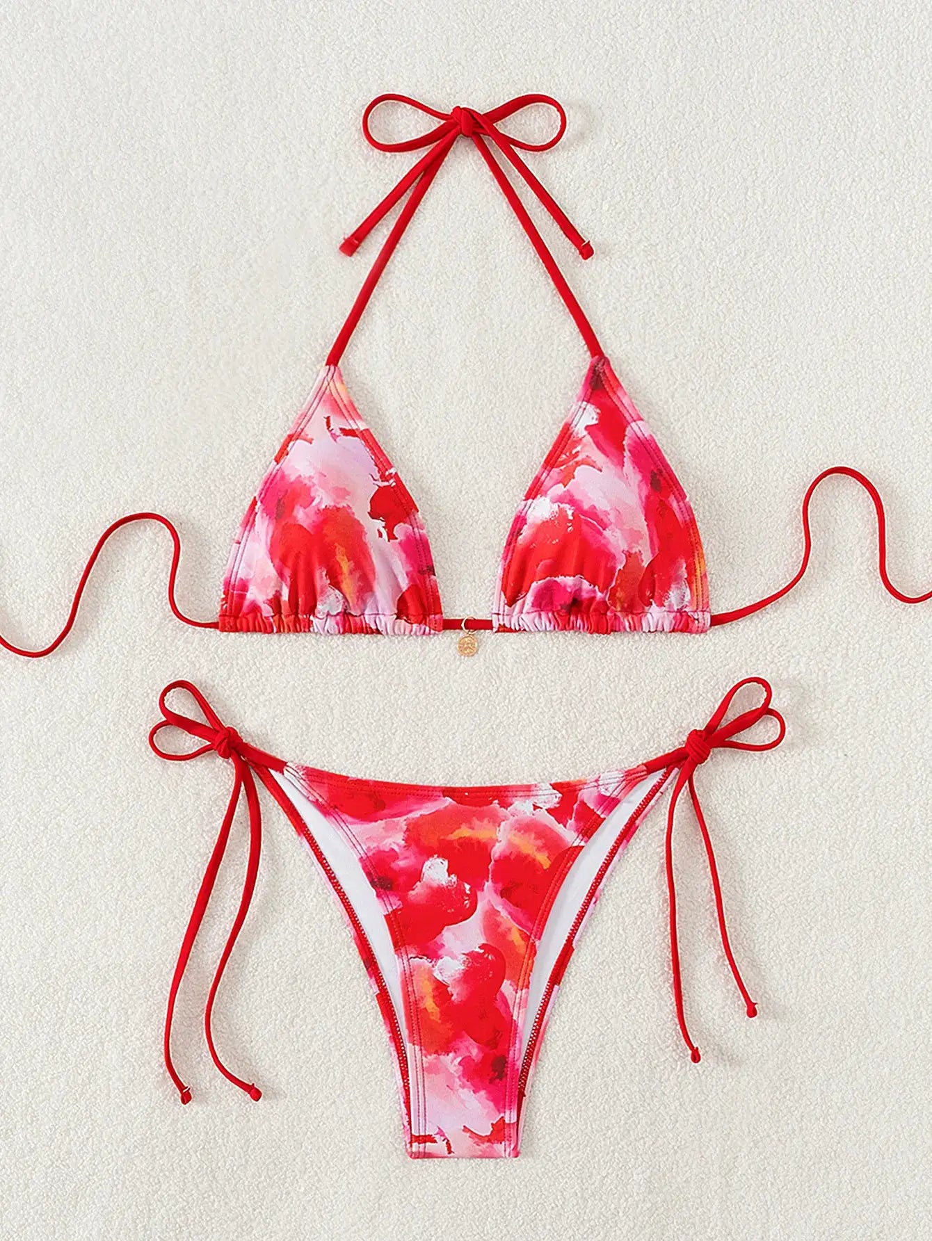 Triangle bikini two-piece set by Simples Market in vibrant red floral print with push-up triangle top and Brazilian-cut bottoms
