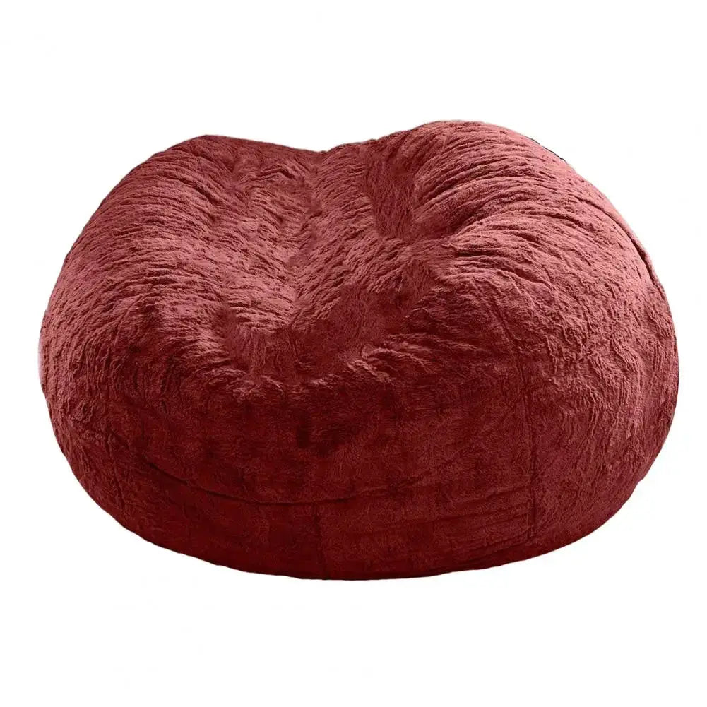Giant red plush bean bag chair with soft fluffy fabric for lounging.
