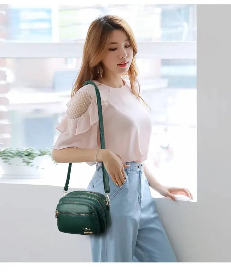 Simples Market green leather crossbody bag with multiple pockets and gold hardware