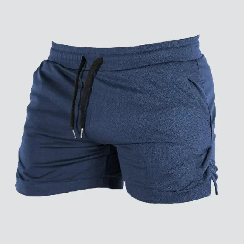 Men's blue gym shorts with elastic waistband, black drawstring, and side pockets.
