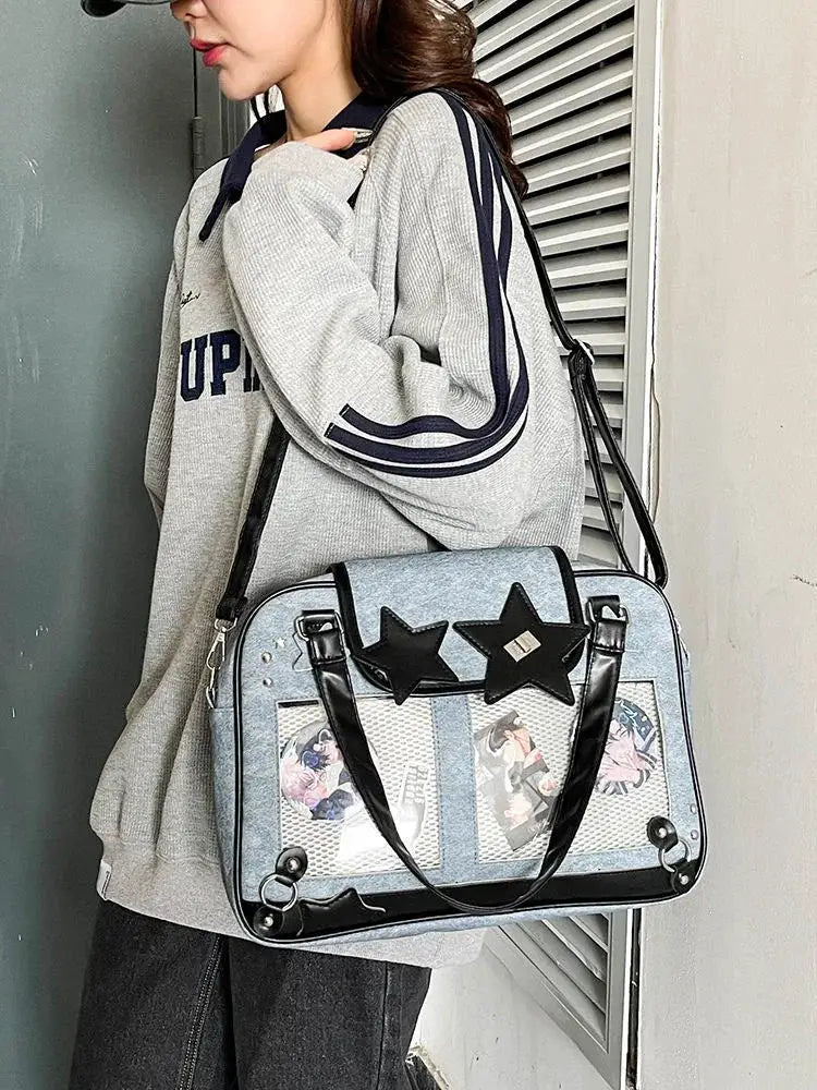 Y2K Star Ita Bag; light blue denim with transparent pockets and black star accents, crossbody purse