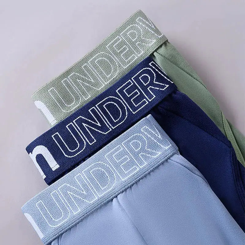 Men's briefs 3-pack in green, navy, and light blue with branded elastic waistbands by Simples Market
