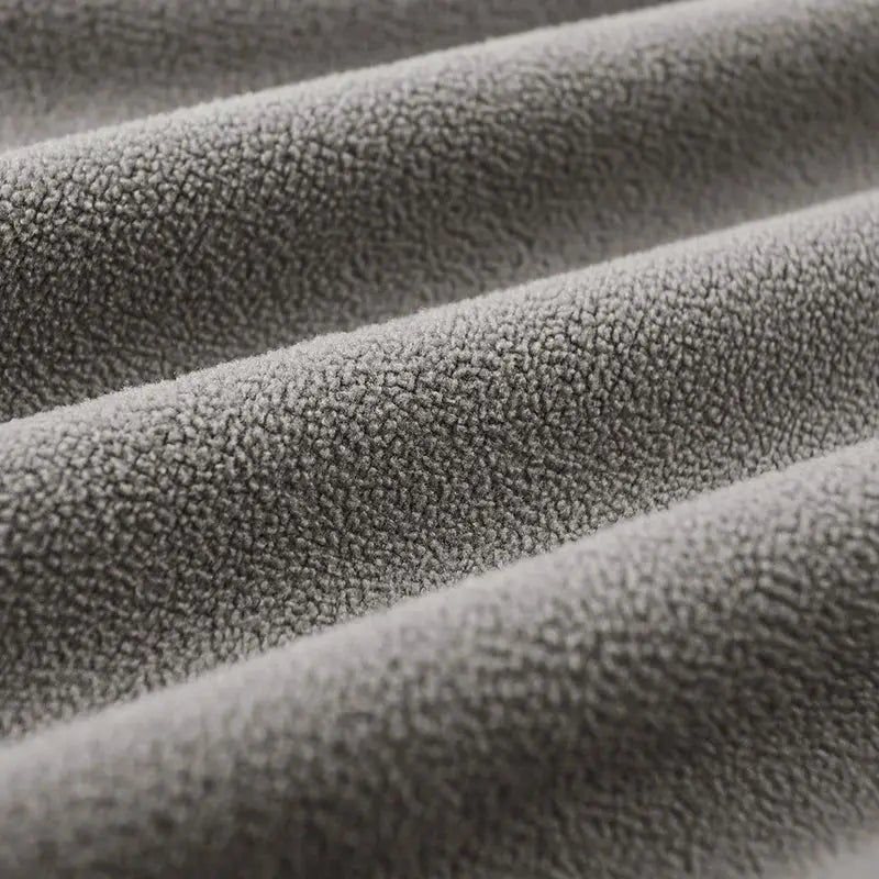 Men's fleece coat fabric close-up in gray, thick warm windproof texture