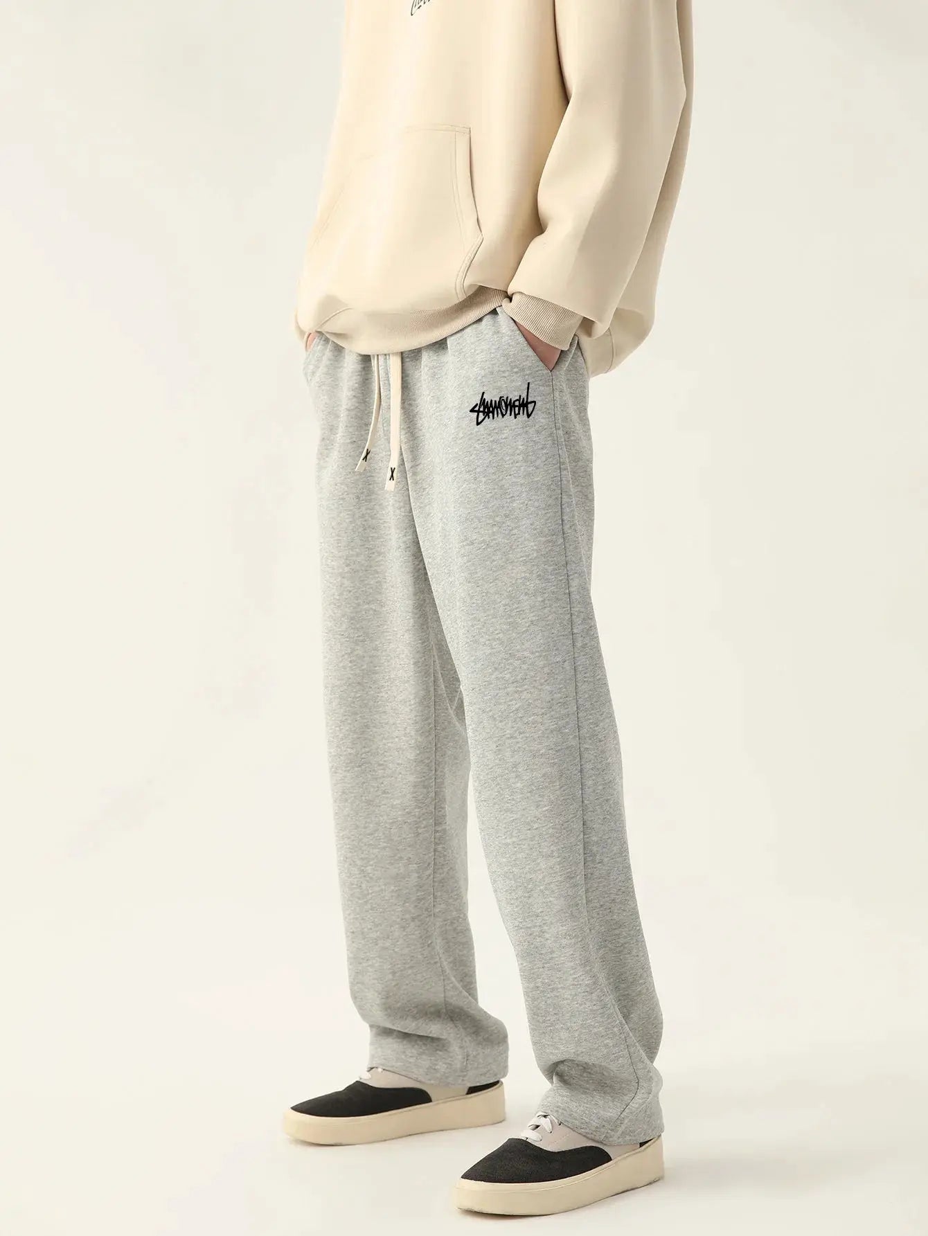 Men's gray heather baggy joggers with drawstring waist and left-thigh logo graphic by Simples Market
