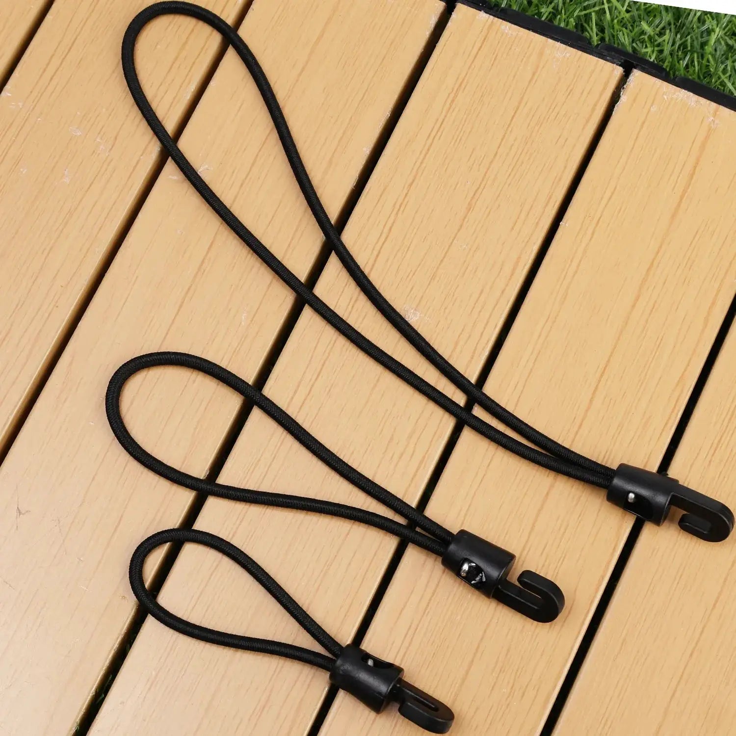 Three black bungee cords with hooks for camping, elastic tie-downs in 10/15/25 cm lengths