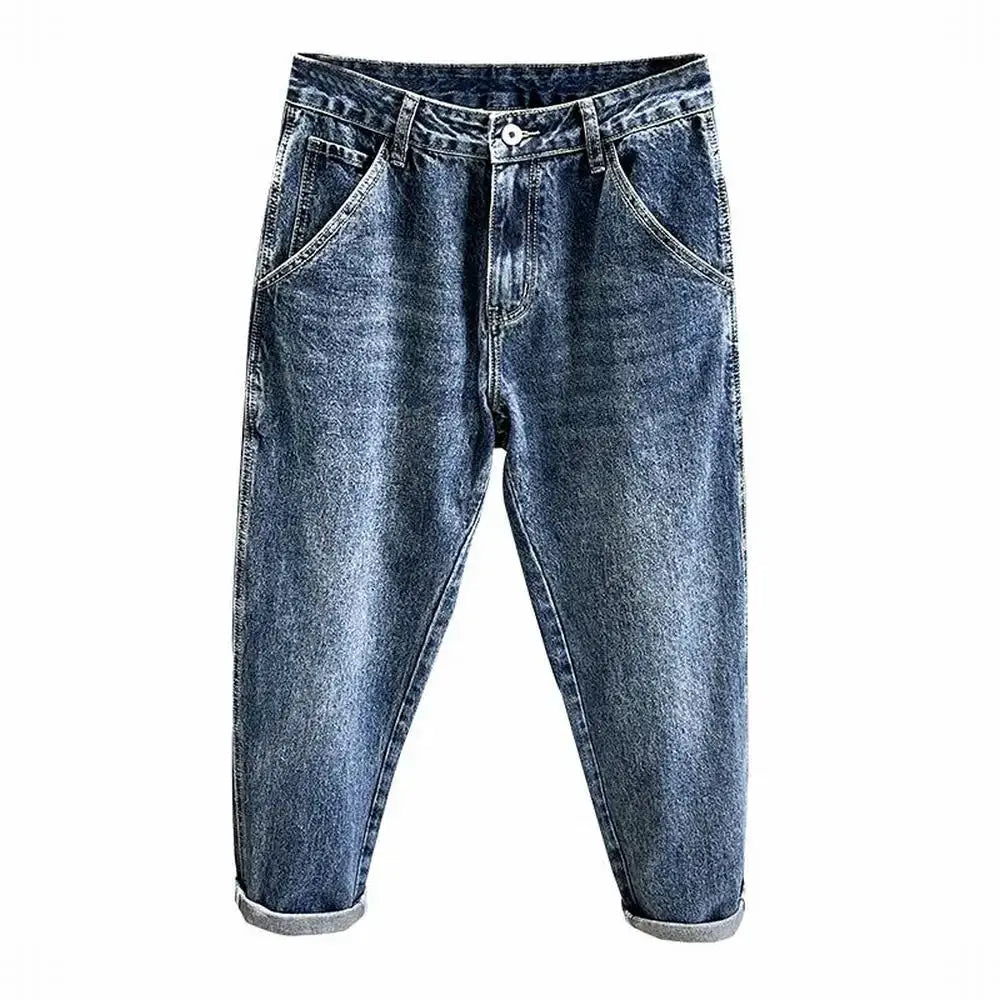 Men's loose tapered blue denim jeans with rolled cuffs