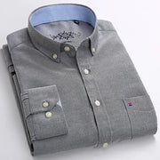 Men's gray long-sleeve oxford shirt with single chest patch pocket and button-down front, blue striped inner collar.